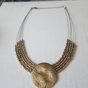Silver and gold colored necklace